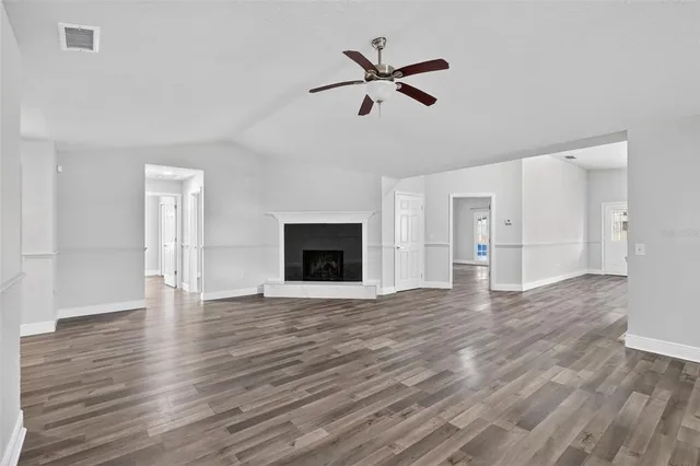 a kitchen with stainless steel appliances kitchen island granite countertop a stove and a refrigerator