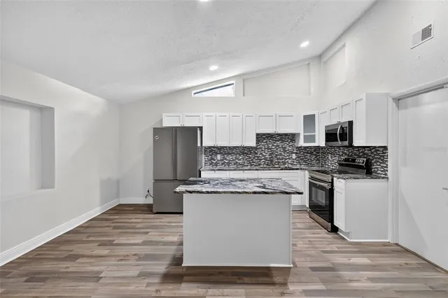 a bathroom with a sink a toilet and bathtub