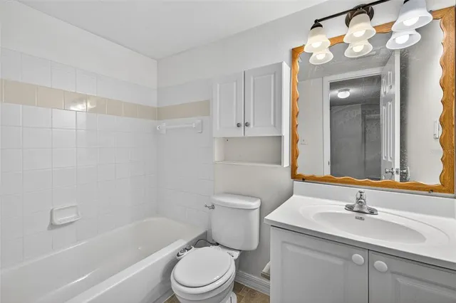 a kitchen with stainless steel appliances a refrigerator stove microwave and sink