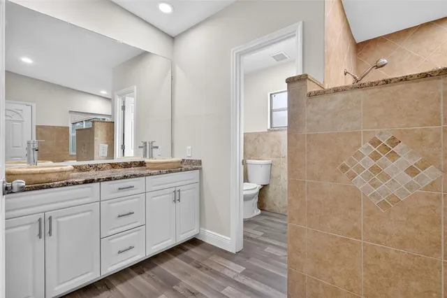a bathroom with a bathtub and shower