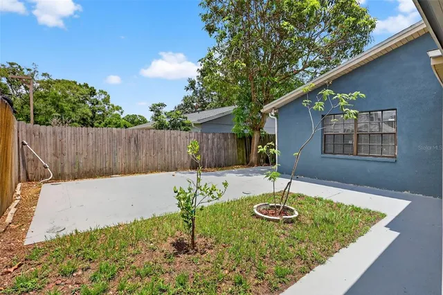 a view of a backyard with a patio