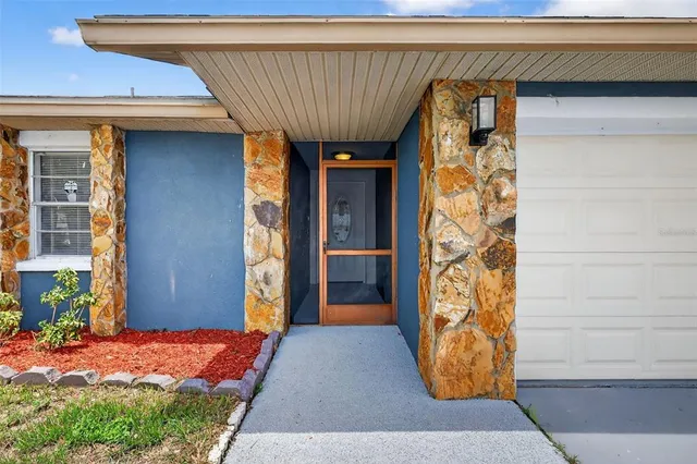 a view of a hallway with wooden floor and a fireplace