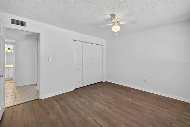 a view of a kitchen with a sink stainless steel appliances and cabinets
