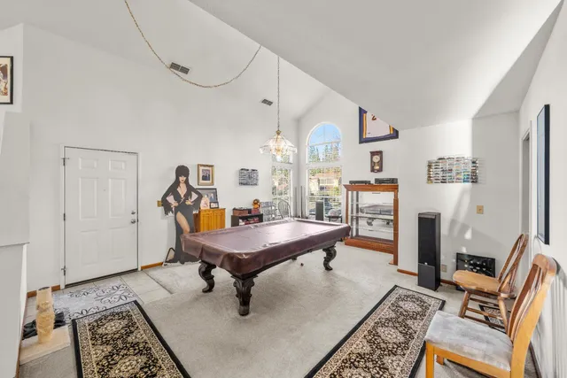 a living room with furniture and a table
