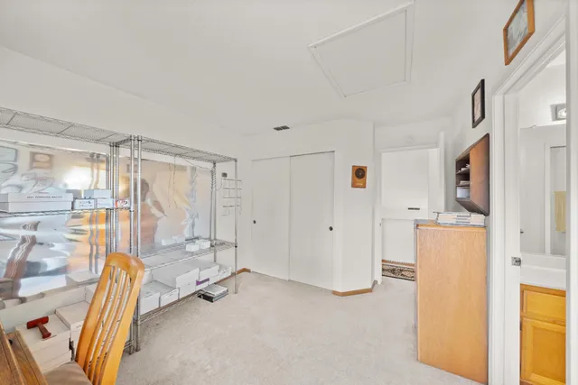 a view of a room with furniture and windows