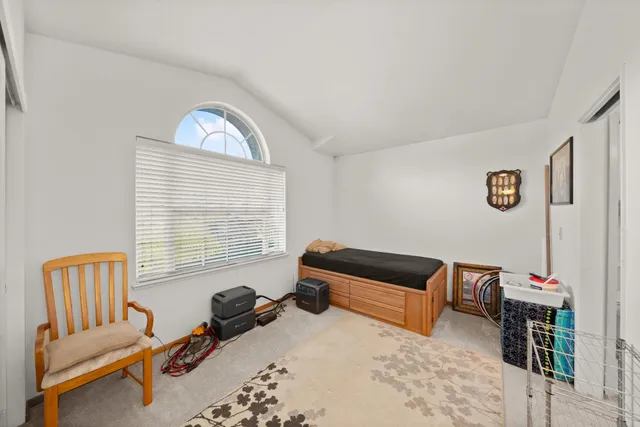 a bedroom with furniture and a window