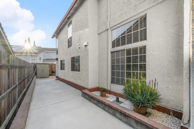a view of a house with a potted plant