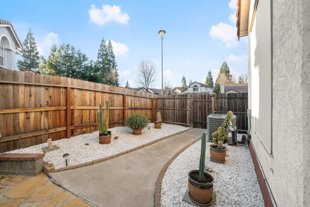 a view of a patio with a table and chairs