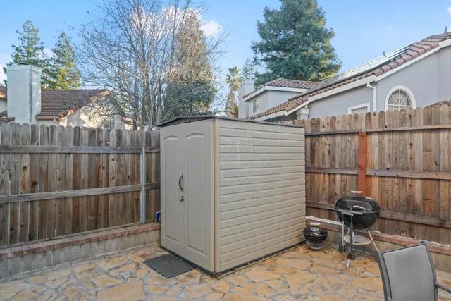 an aerial view of a house with a swimming pool