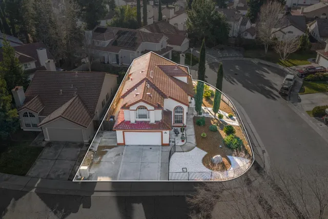 an aerial view of residential house with outdoor space and swimming pool