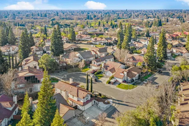 an aerial view of residential house with outdoor space and river