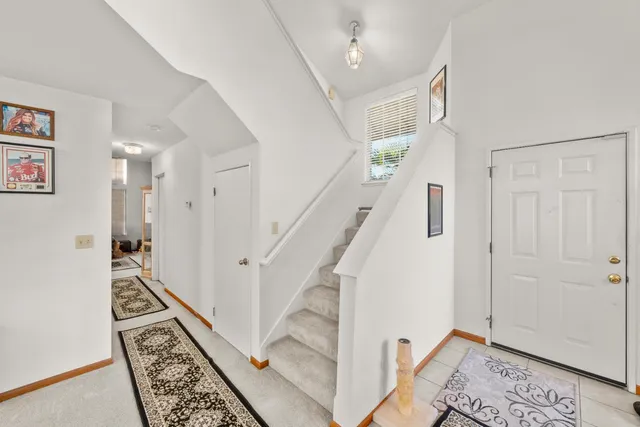 a view of entryway with stairs and wooden floor