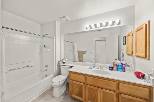 a bathroom with a sink a toilet and a bathtub