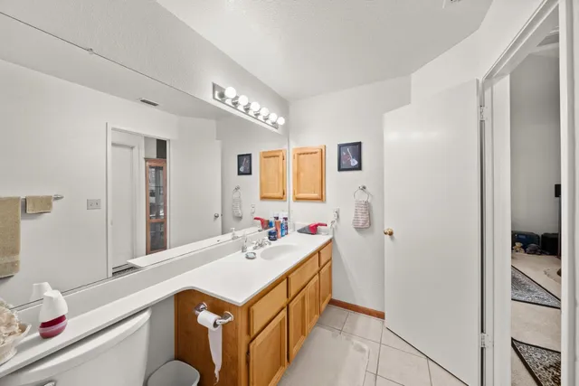 a bathroom with a sink double vanity and a mirror