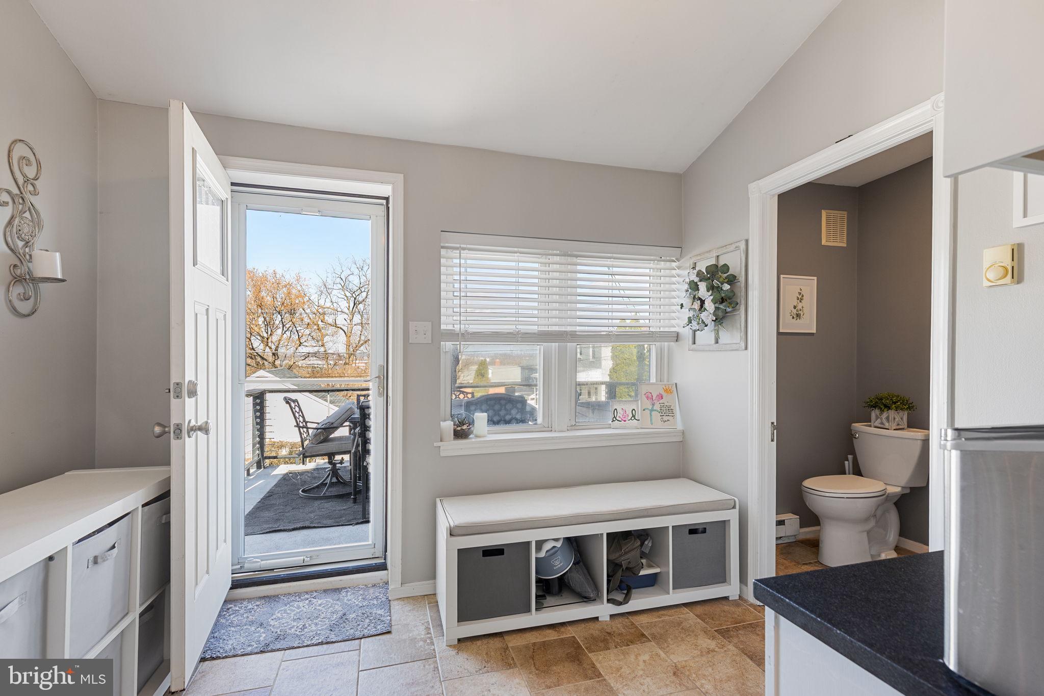 820 Maple Street Conshohocken, PA 19428 - Photo 20 of 43 a living room with stainless steel appliances a stove and a window