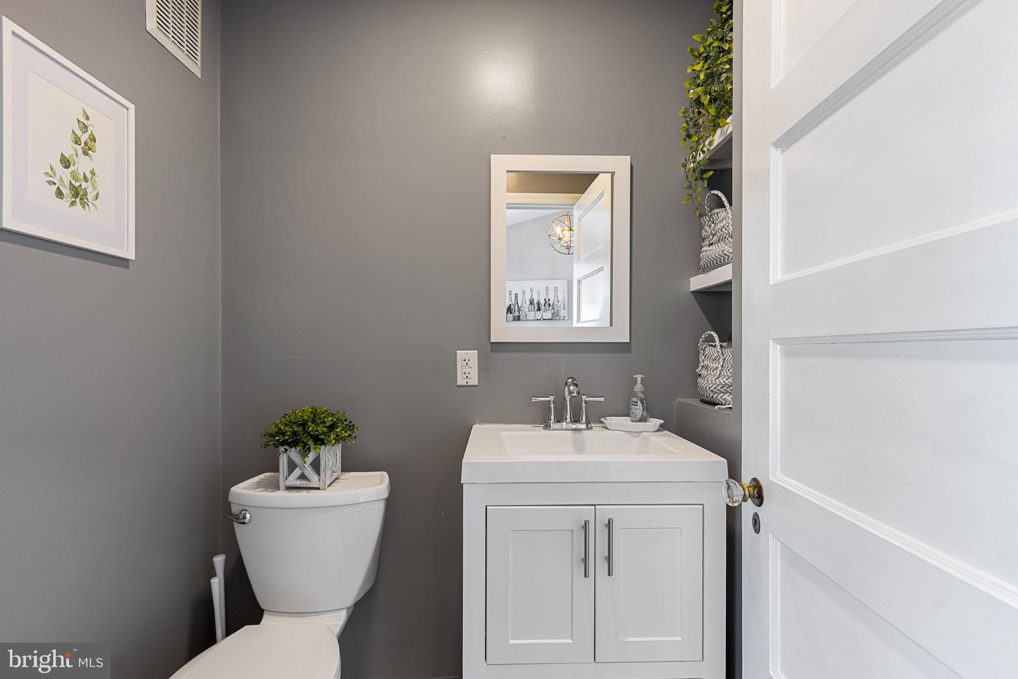 820 Maple Street Conshohocken, PA 19428 - Photo 23 of 43 a bathroom with a toilet sink and mirror