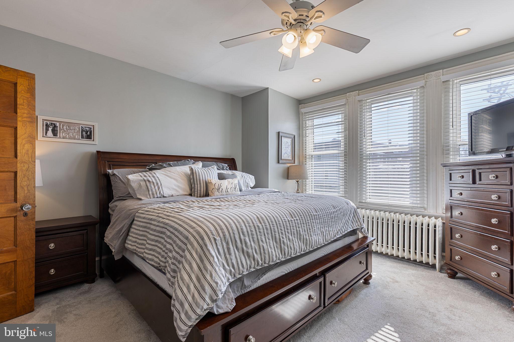 820 Maple Street Conshohocken, PA 19428 - Photo 29 of 43 a bedroom with a bed chandelier and a window
