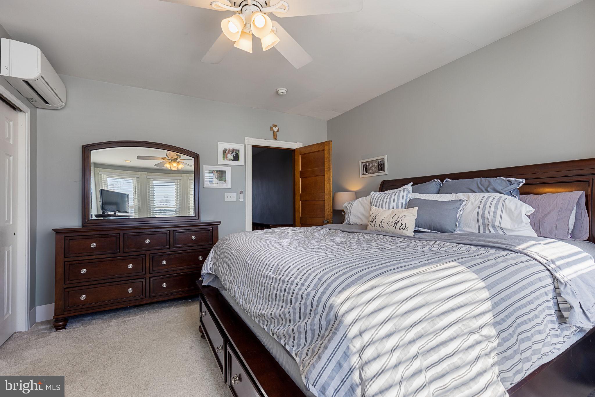 820 Maple Street Conshohocken, PA 19428 - Photo 30 of 43 a bedroom with a bed and a mirror