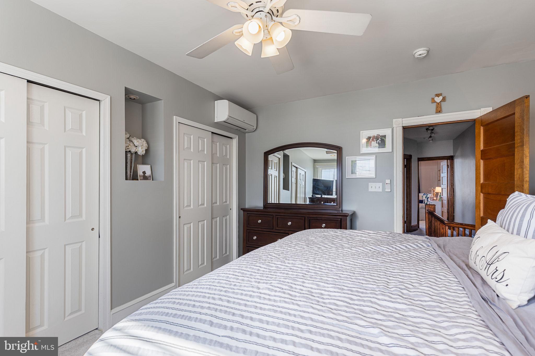 820 Maple Street Conshohocken, PA 19428 - Photo 31 of 43 a bedroom with a bed and a chandelier