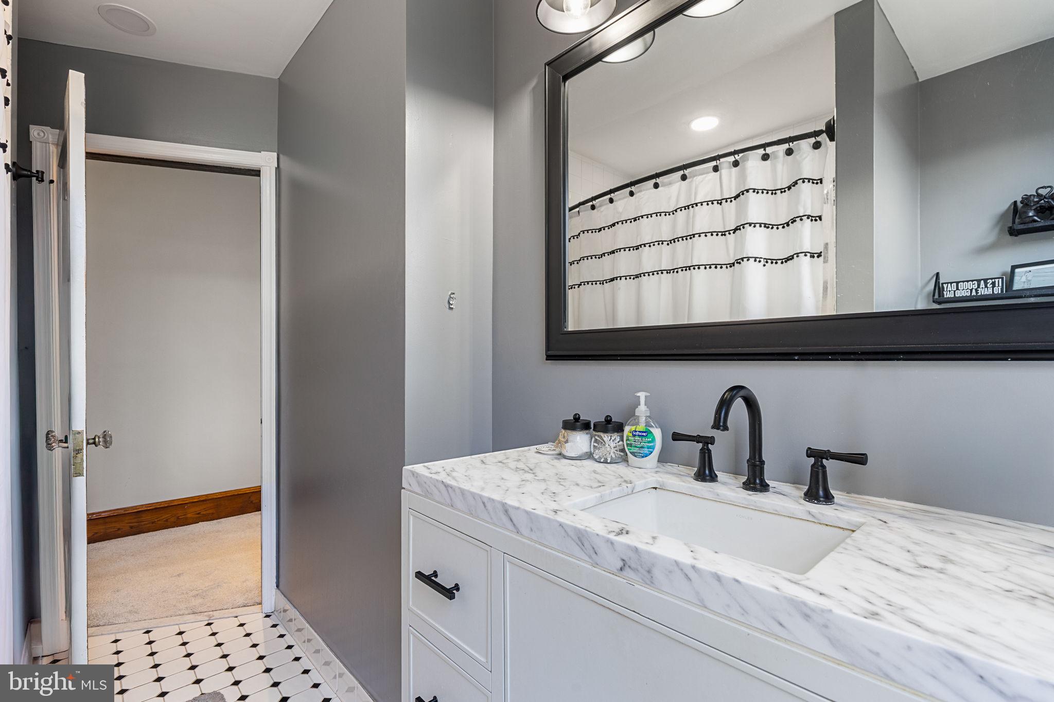 820 Maple Street Conshohocken, PA 19428 - Photo 37 of 43 a bathroom with a sink and a mirror