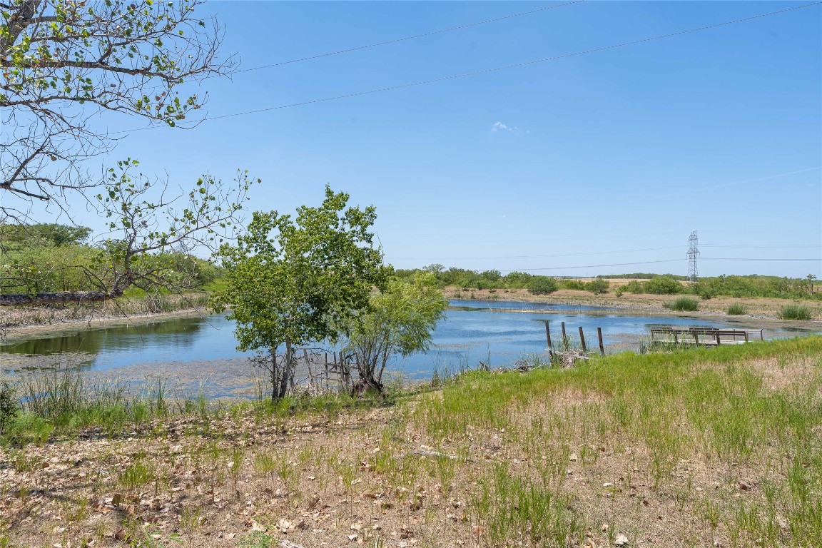 Tbd Tbd Bluebonnet Road Lockhart, TX 78644 - Photo 17 of 32 a view of a lake with houses in the back