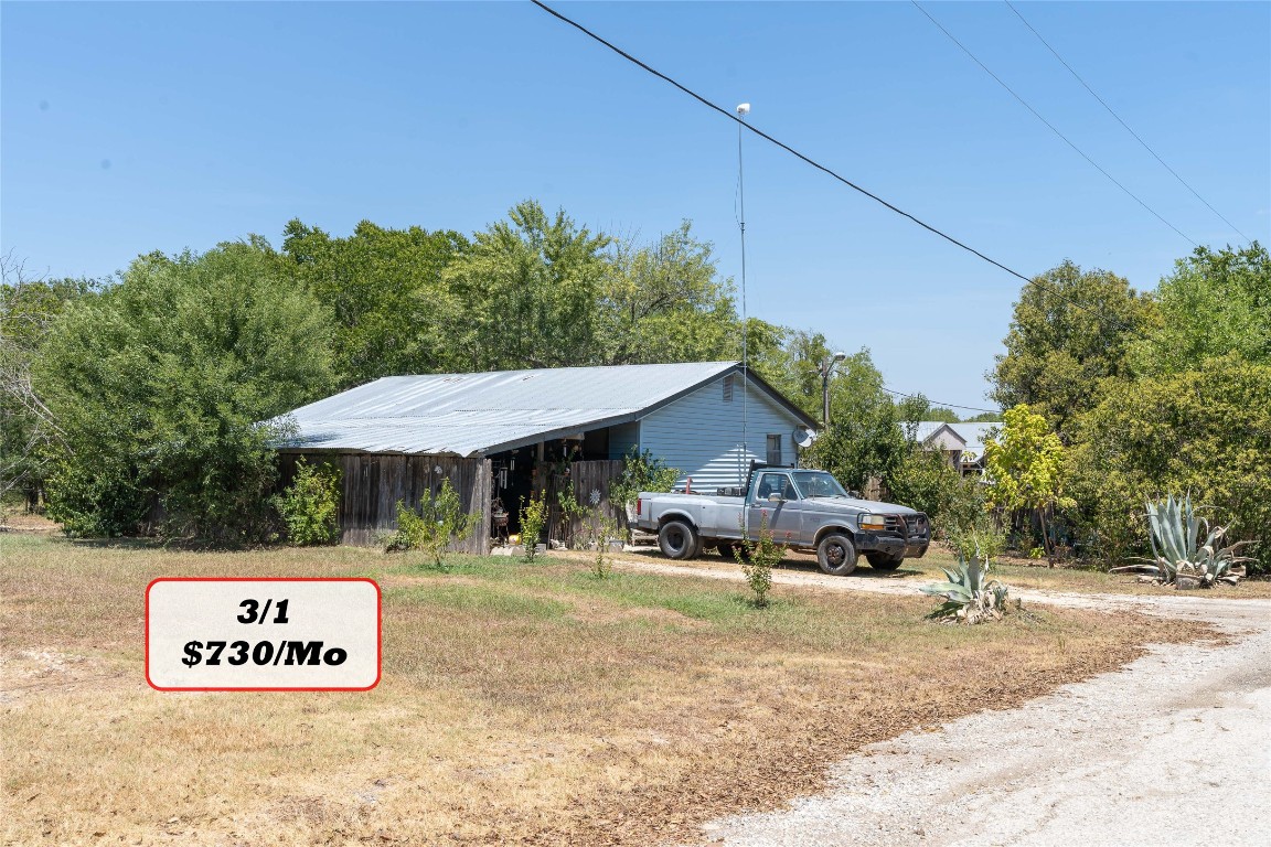Tbd Tbd Bluebonnet Road Lockhart, TX 78644 - Photo 23 of 32 a view of a house with a yard and sitting area