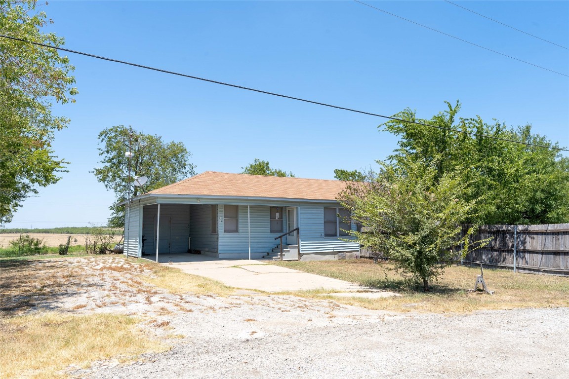 Tbd Tbd Bluebonnet Road Lockhart, TX 78644 - Photo 28 of 32 a front view of a house with a yard