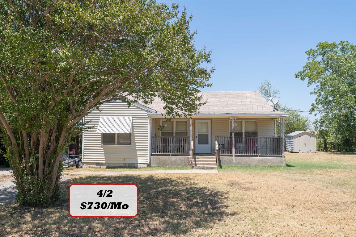 Tbd Tbd Bluebonnet Road Lockhart, TX 78644 - Photo 30 of 32 a front view of a house with a garden