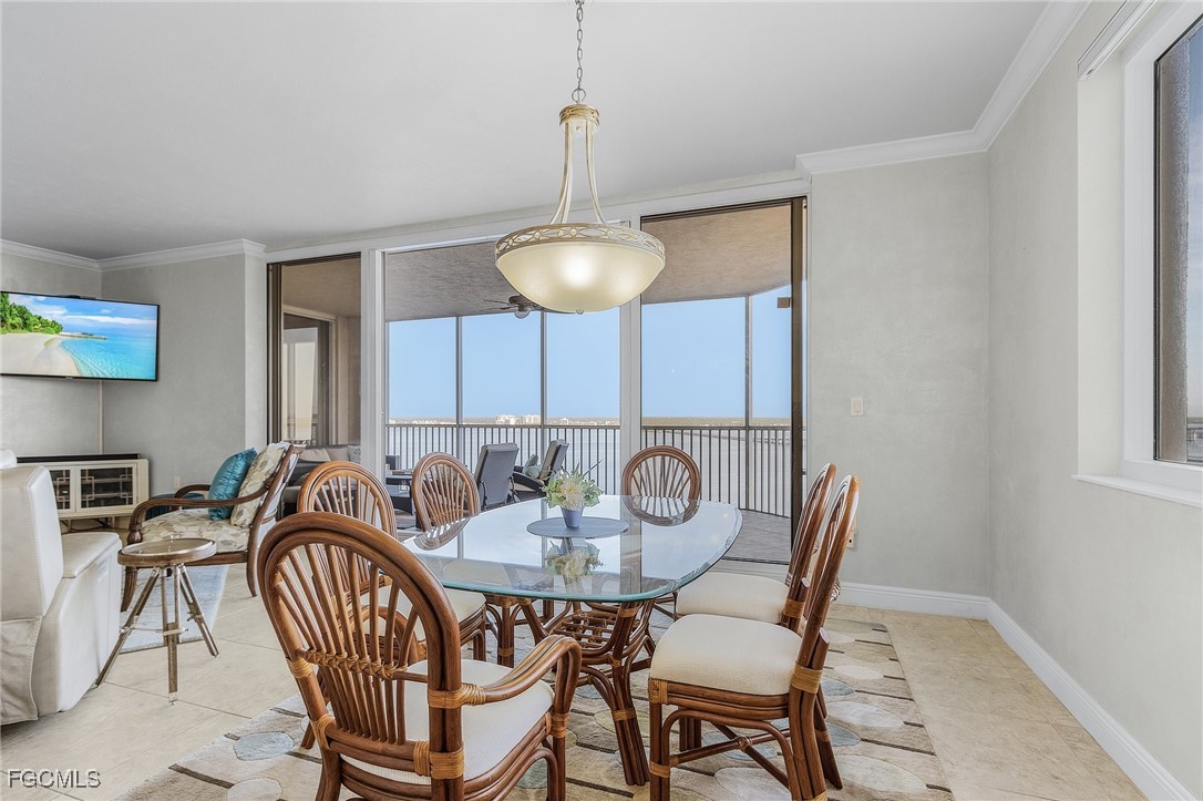 2090 West First Street, Unit 1606 Fort Myers, FL 33901 - Photo 11 of 47 a view of a dining room and hall with furniture