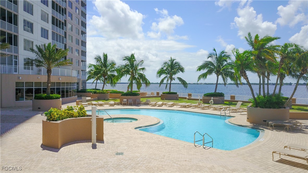 2090 West First Street, Unit 1606 Fort Myers, FL 33901 - Photo 35 of 47 a view of swimming pool with outdoor seating and plants