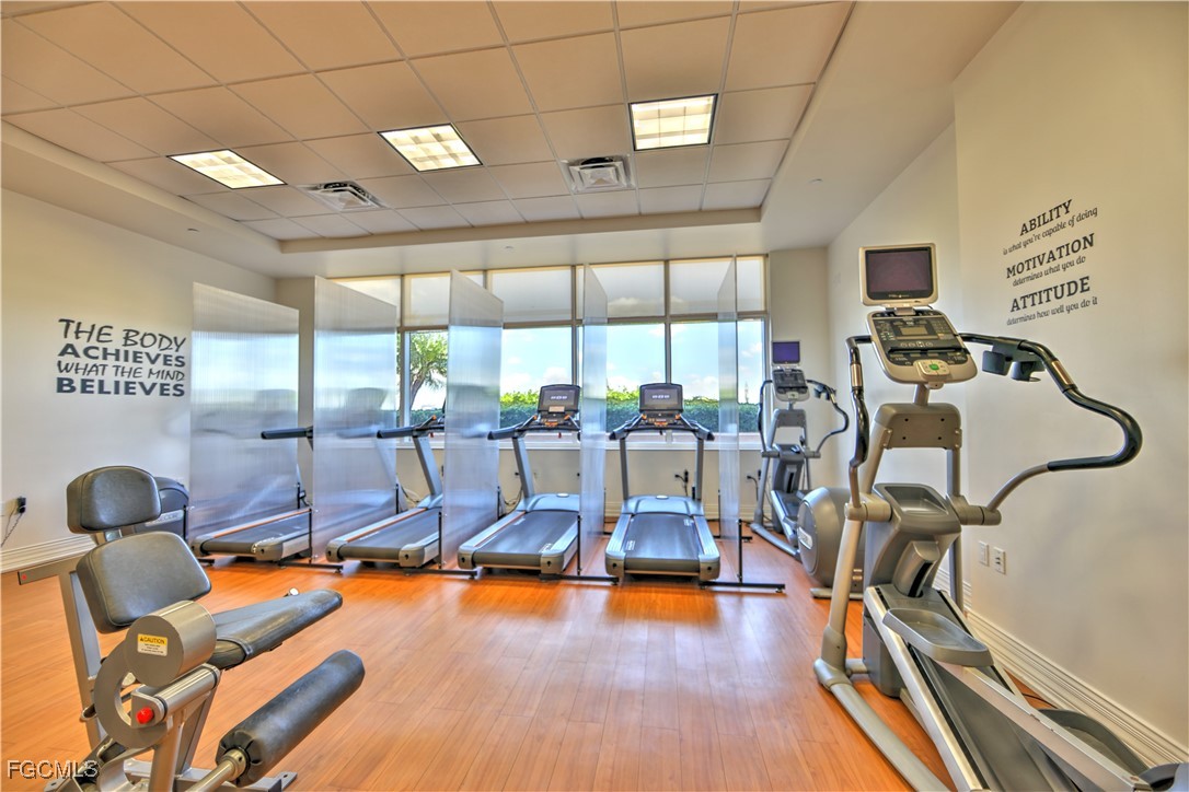2090 West First Street, Unit 1606 Fort Myers, FL 33901 - Photo 44 of 47 a room with gym equipment and windows