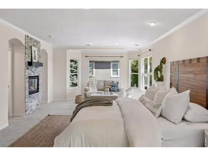 a bedroom with a bed and a couch