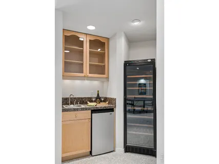 a kitchen with a refrigerator and cabinets