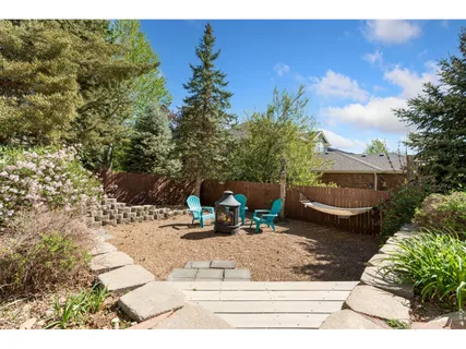 a view of a backyard with sitting area