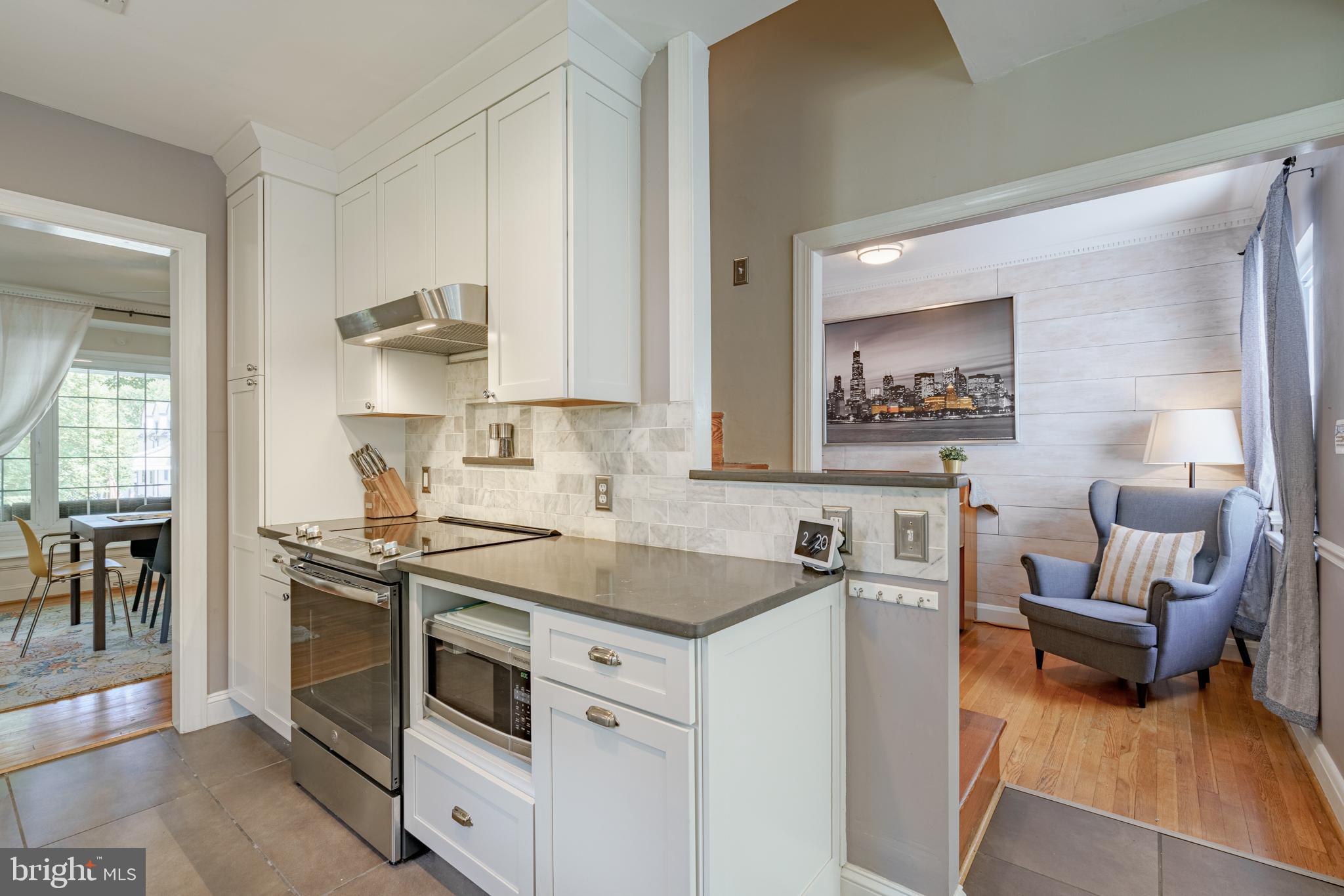 7110 Bristol Road Baltimore, MD 21212 - Photo 19 of 58 Clean white kitchen with new exhaust fan.