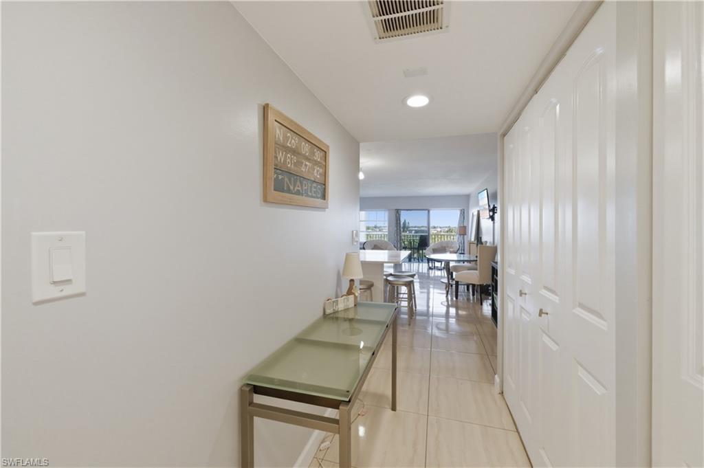 1 Bluebill Avenue, Unit 605 Naples, FL 34108 - Photo 6 of 20 Entryway with light tile patterned flooring and recessed lighting