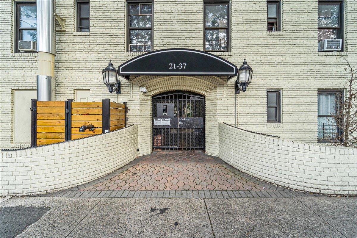 21-37 33rd Street, Unit 3D Queens, NY 11105 - Photo 14 of 15 a front view of a house with large windows