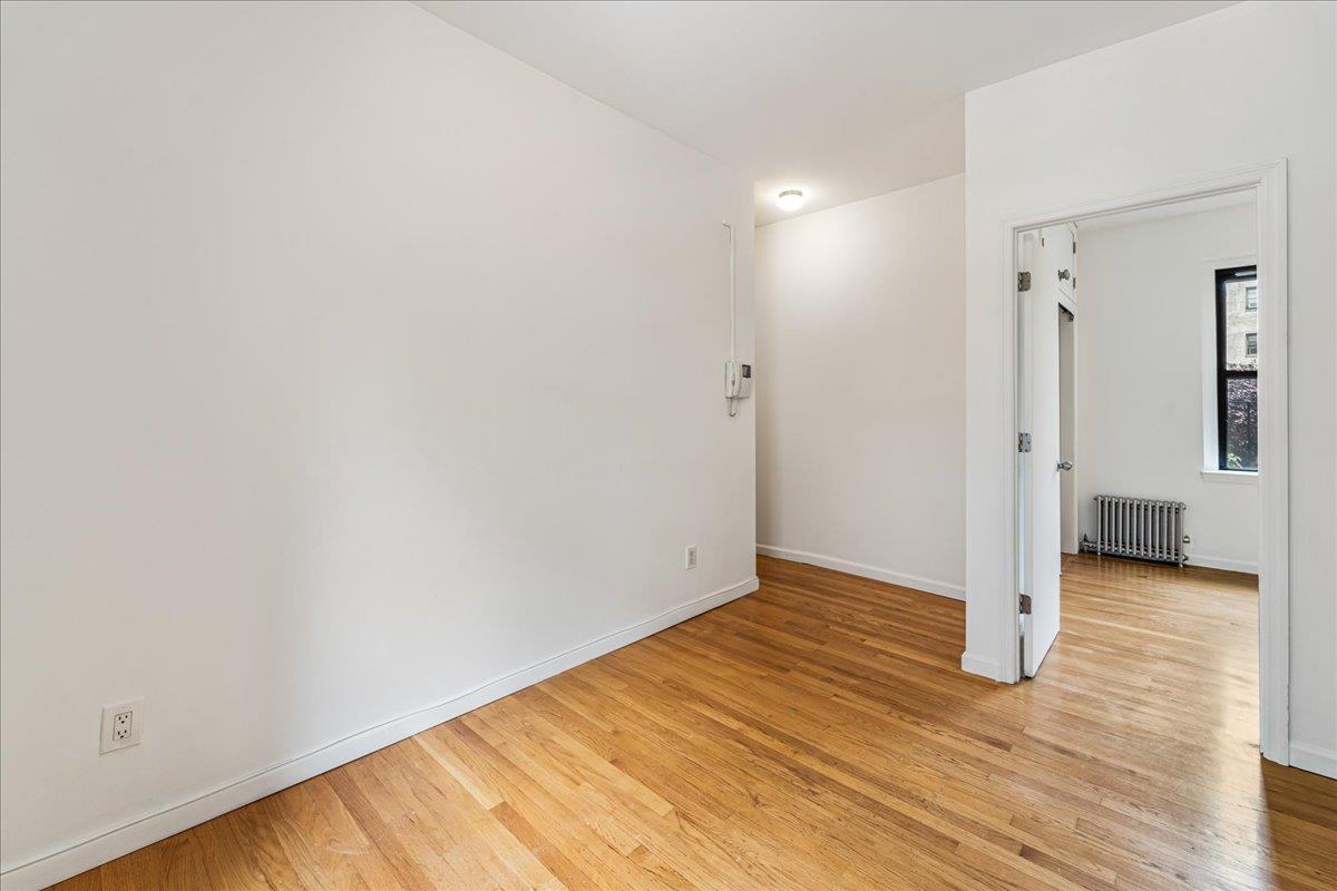 21-37 33rd Street, Unit 3D Queens, NY 11105 - Photo 3 of 15 a view of a room with wooden floor