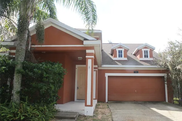 a front view of a house with a garage