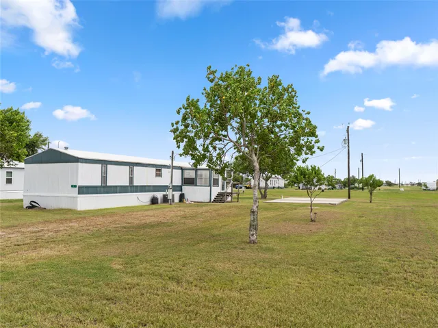 a swimming pool with an outdoor space and seating
