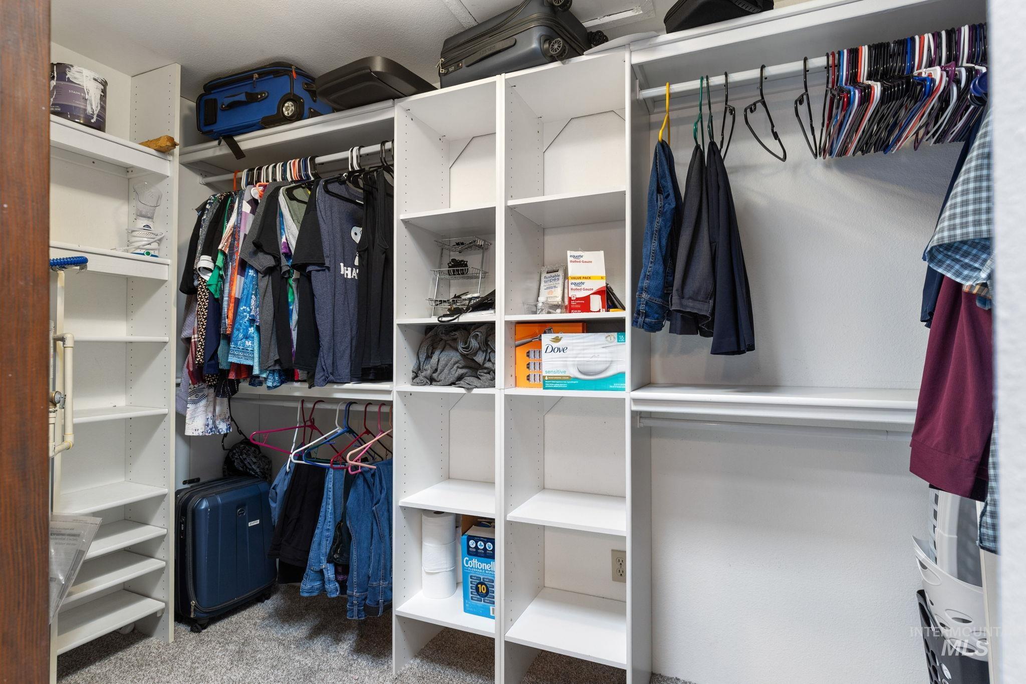 18338 Pride Lane Caldwell, ID 83607 - Photo 26 of 50 Custom closet system featuring multiple shelving units and hanging rods