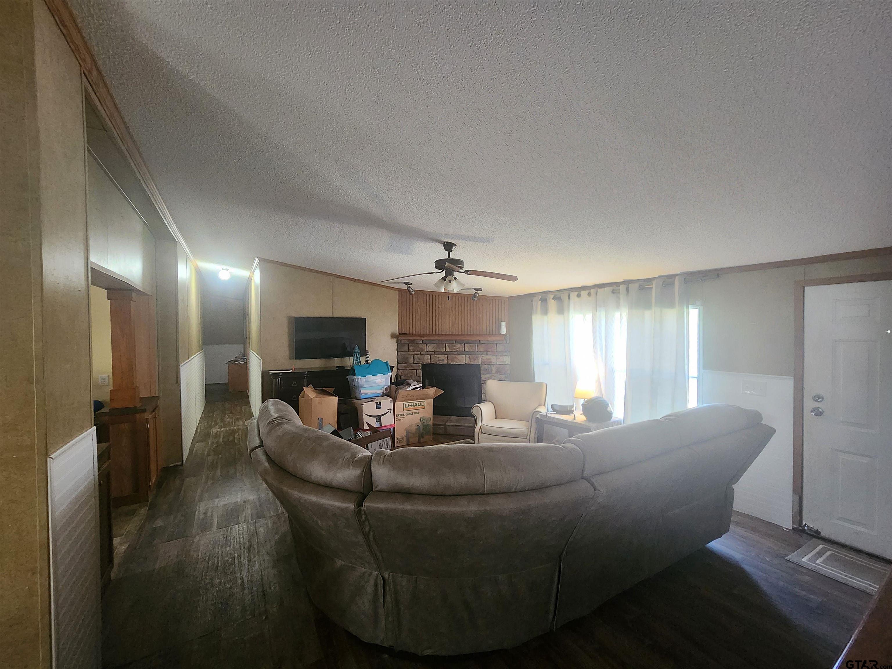 11308 E Creek Tyler, TX 75708 - Photo 3 of 14 a living room with furniture and a wooden floor