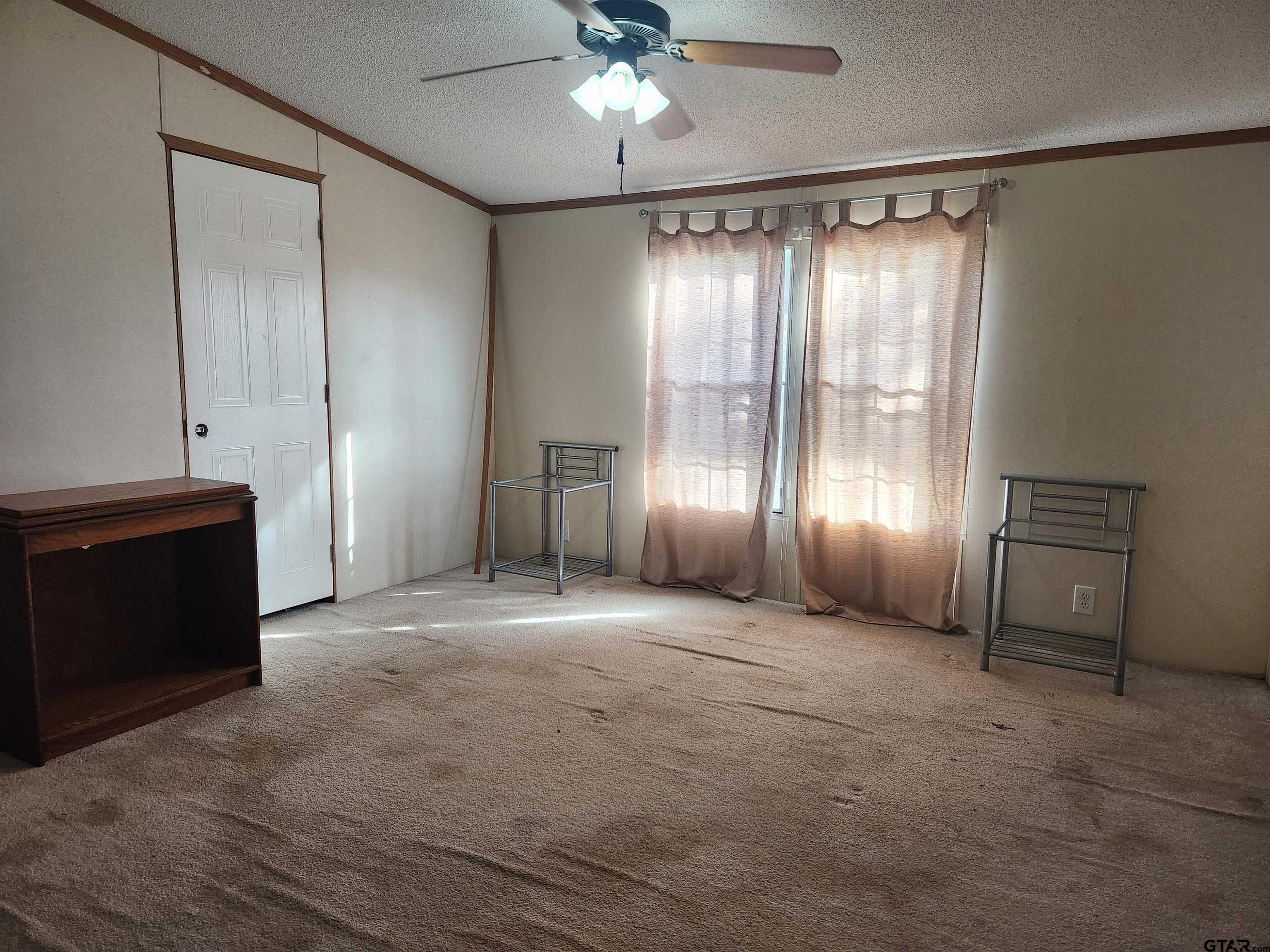 11308 E Creek Tyler, TX 75708 - Photo 8 of 14 a view of empty room with a ceiling fan and window