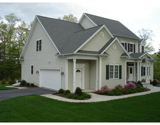1340 Piper Road West Springfield, MA 01089 - Photo 2 of 10 a front view of a house with a yard and garage