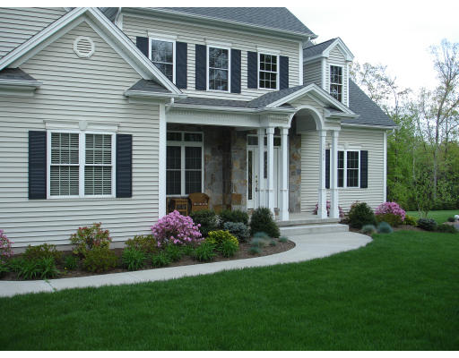 1340 Piper Road West Springfield, MA 01089 - Photo 10 of 10 a front view of a house with garden and porch