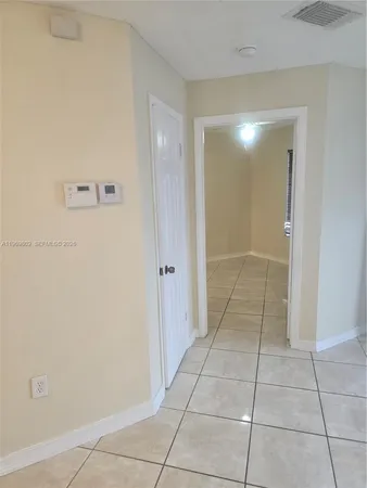 a view of hallway with a window
