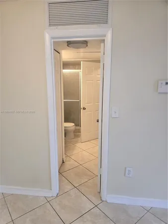 a view of a bathroom with a glass door
