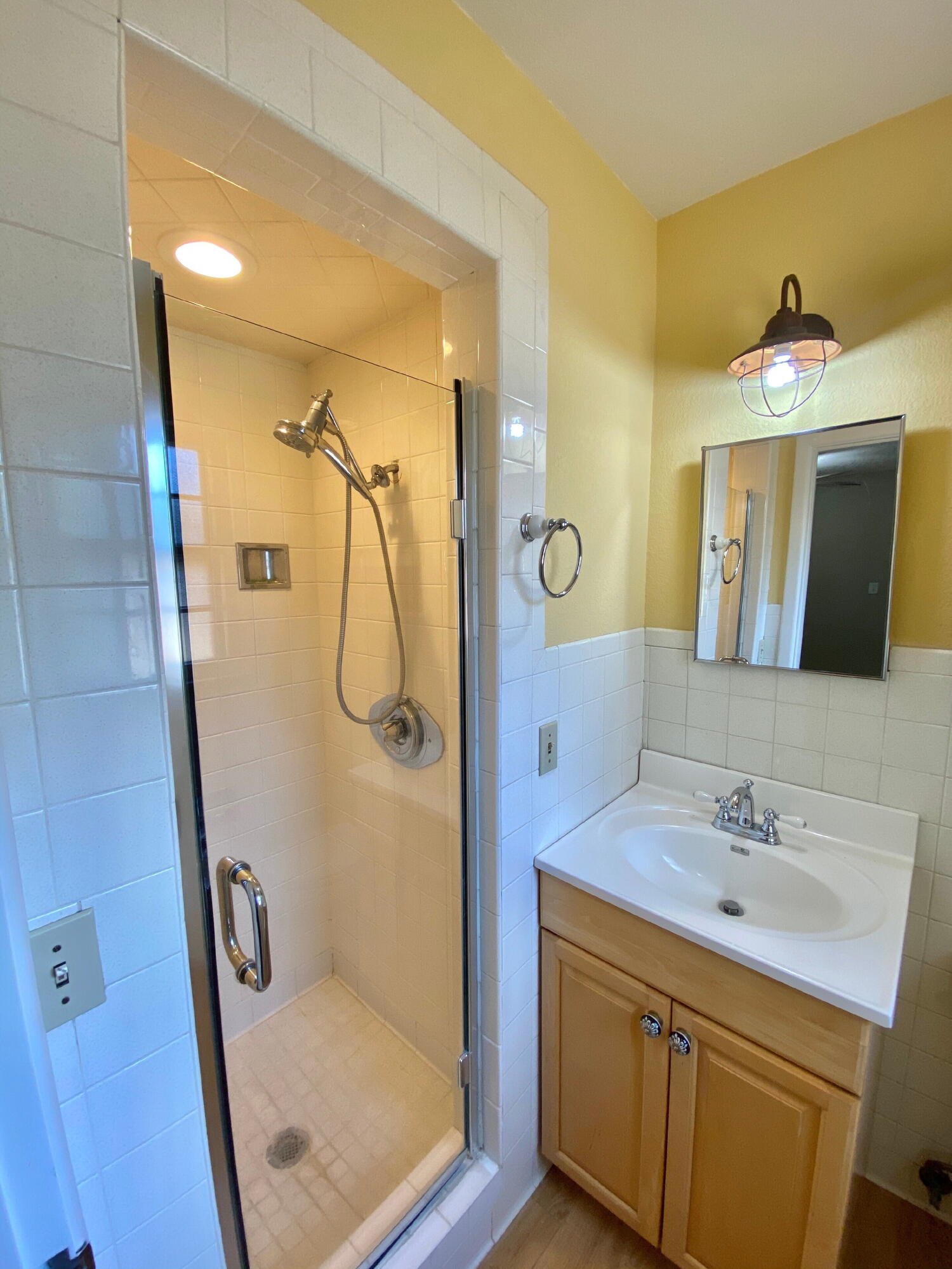 3509 37th Street Lubbock, TX 79413 - Photo 14 of 24 a bathroom with a shower sink and mirror