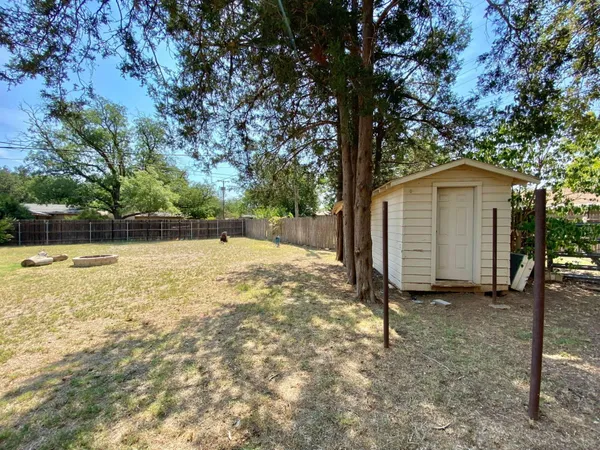 a house with trees in the background