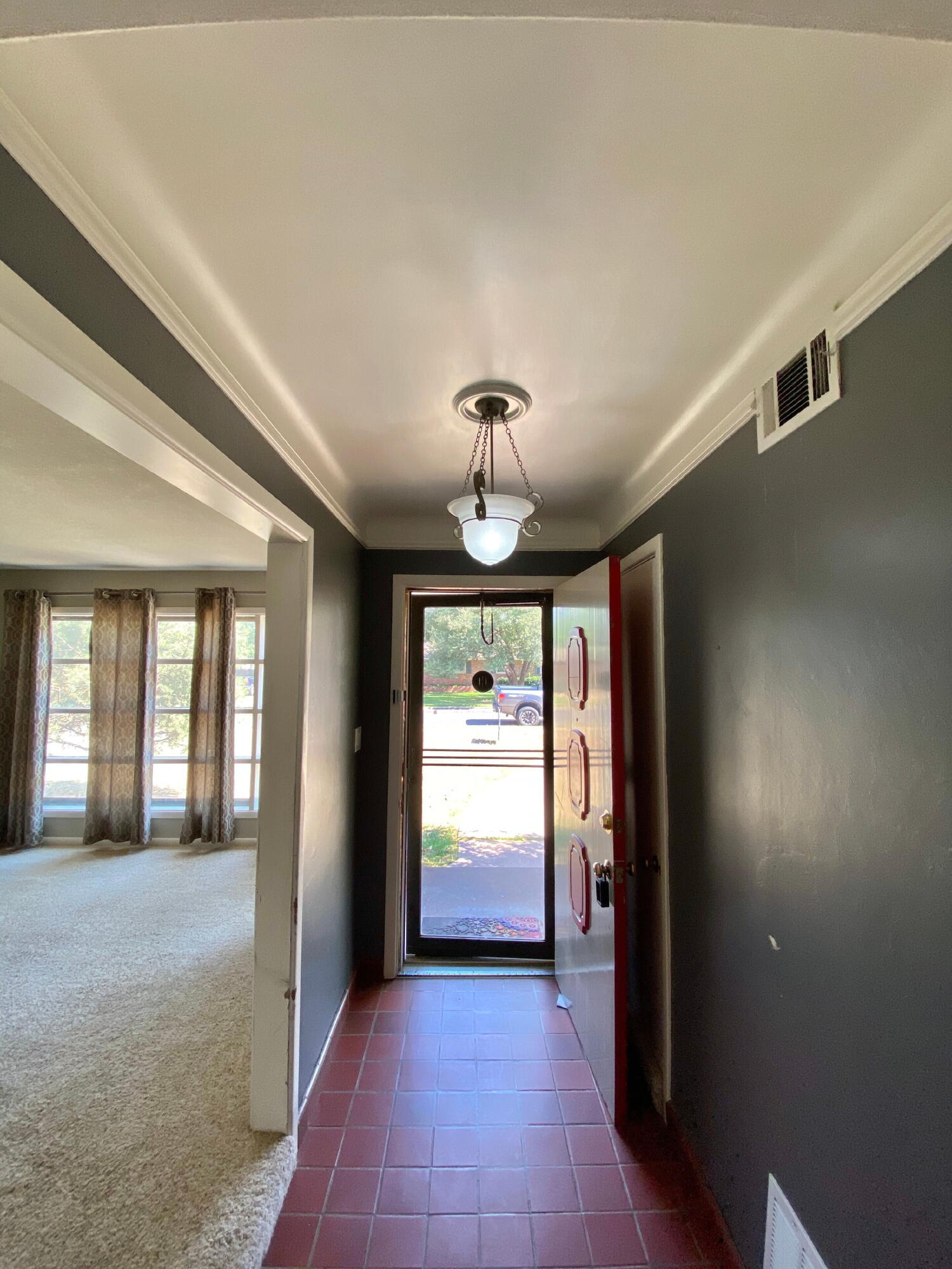 3509 37th Street Lubbock, TX 79413 - Photo 3 of 24 a view of a hallway with a chandelier